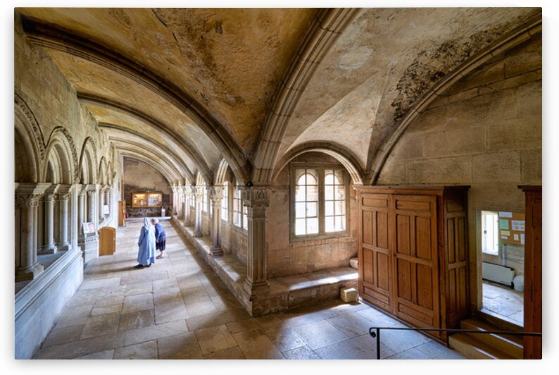 Nun walking in the cloister of Vezelay Abbey in Bourgogne France by Marco Brivio