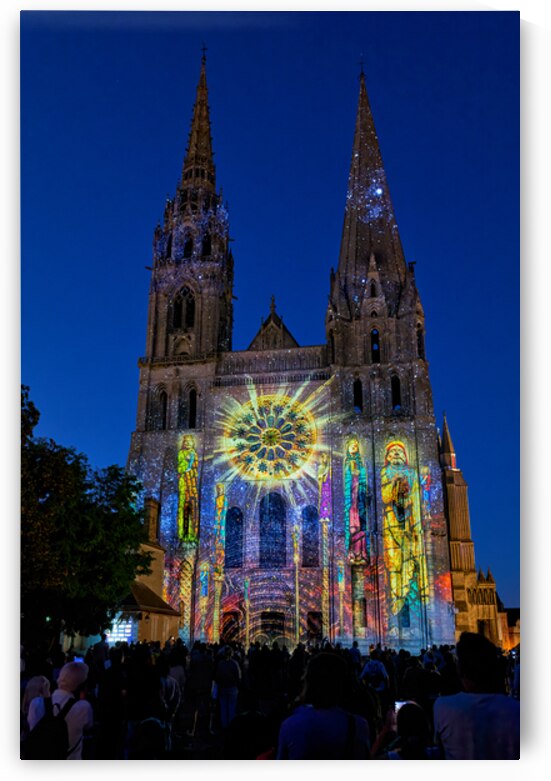 Cathedral in Chartres France lit up at night with colorful proje by Marco Brivio