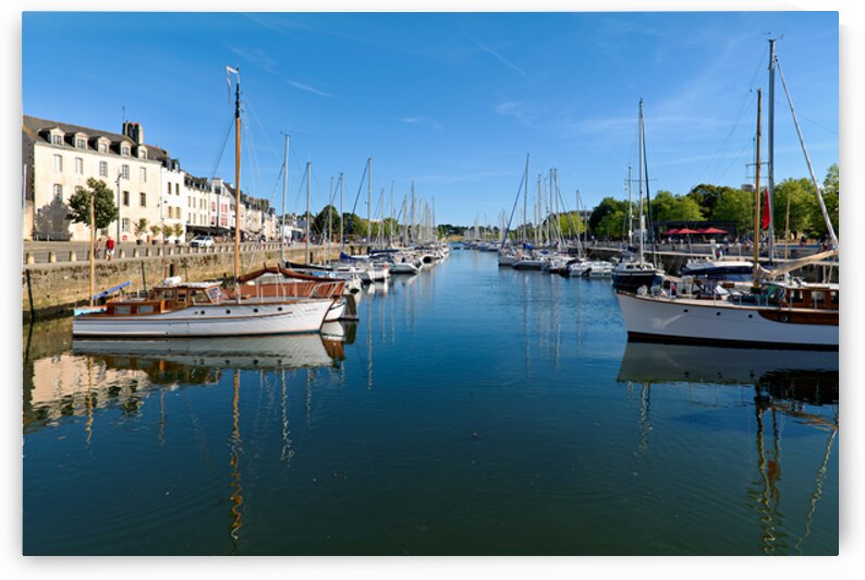 Boats moored in Vannes port on a clear day in Brittany France by Marco Brivio