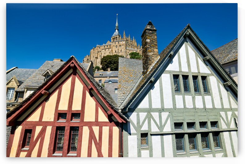 Visit Mont Saint Michel in Normandy France under clear blue sky by Marco Brivio