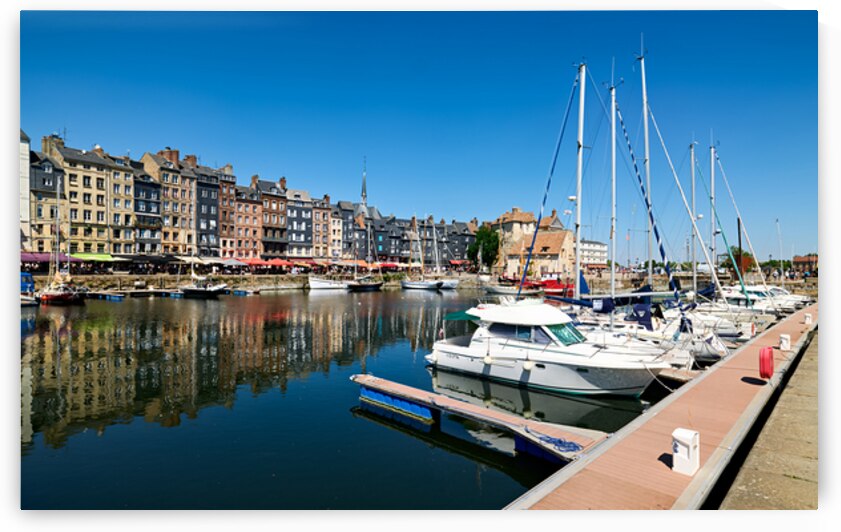 Boats docked at Honfleur harbor in Normandy France during a sunn by Marco Brivio