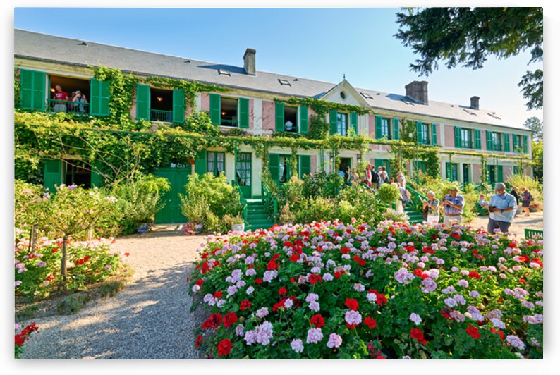 Visitors admire Monets house and garden in Giverny Normandy Fra by Marco Brivio
