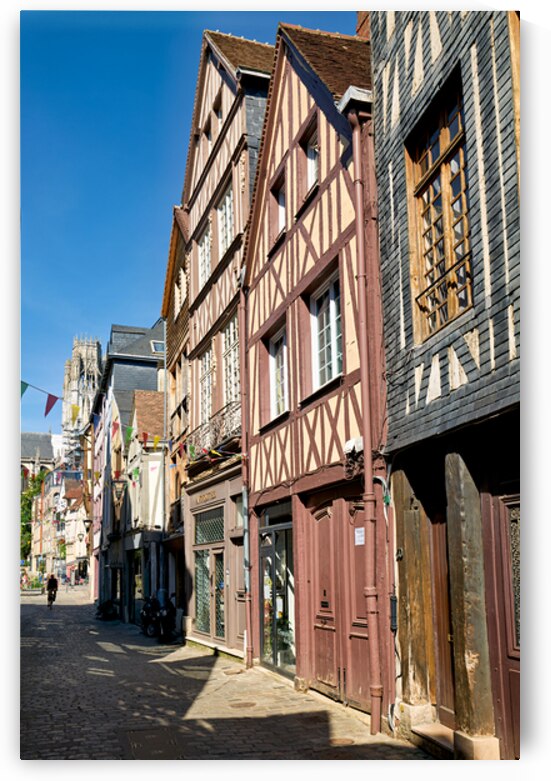 Timber houses line the street in Rouen Normandy France on a sunn by Marco Brivio