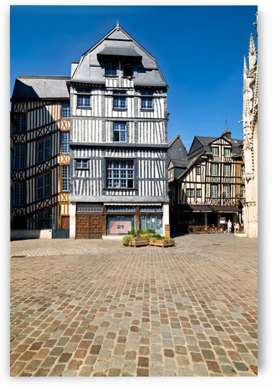 Timber houses in Rouen Normandy France under clear blue sky by Marco Brivio