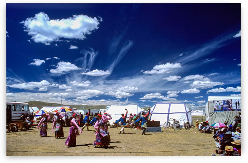 Outdoor festival in Tibet with traditional dancing and tents by Marco Brivio
