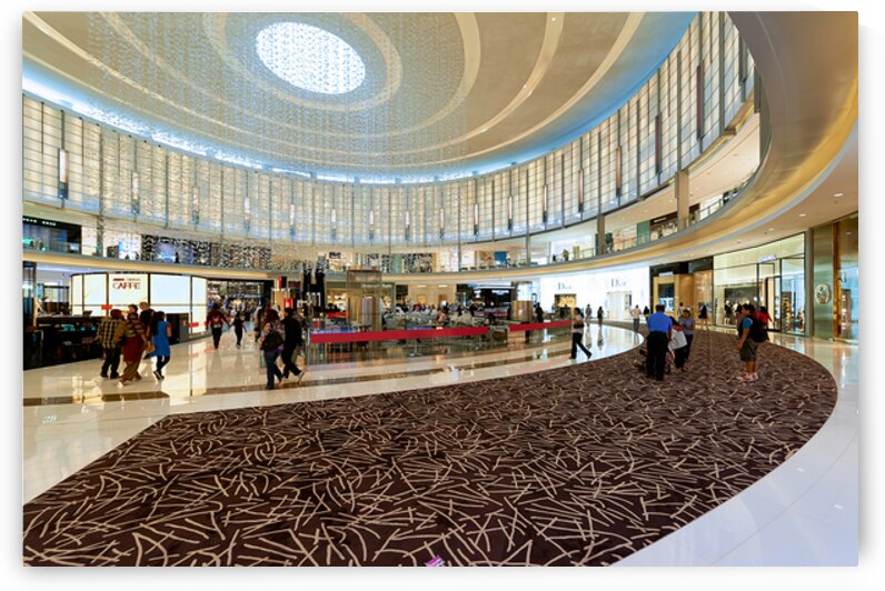 Modern shopping mall in Dubai with people and luxury brands by Marco Brivio