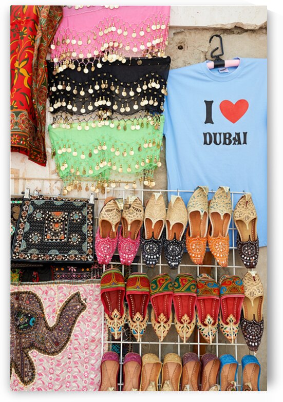 Traditional market in Dubai with shoes and scarves for sale by Marco Brivio