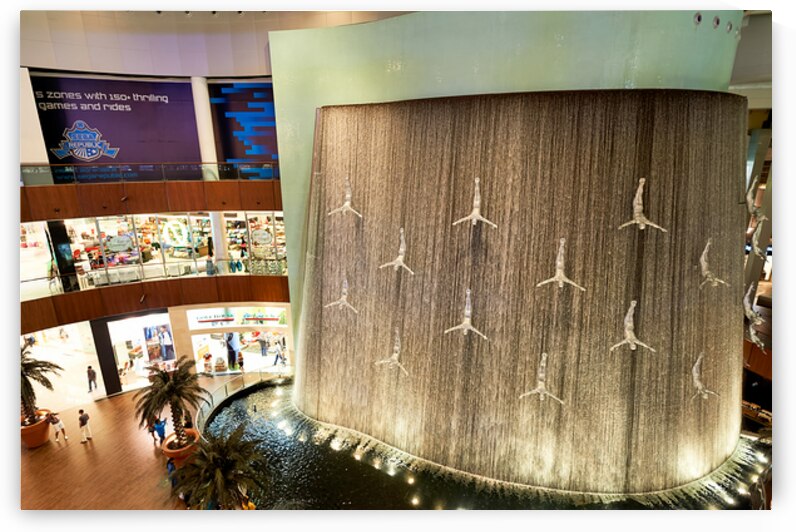 Indoor waterfall with diver sculptures in a mall in Dubai UAE by Marco Brivio