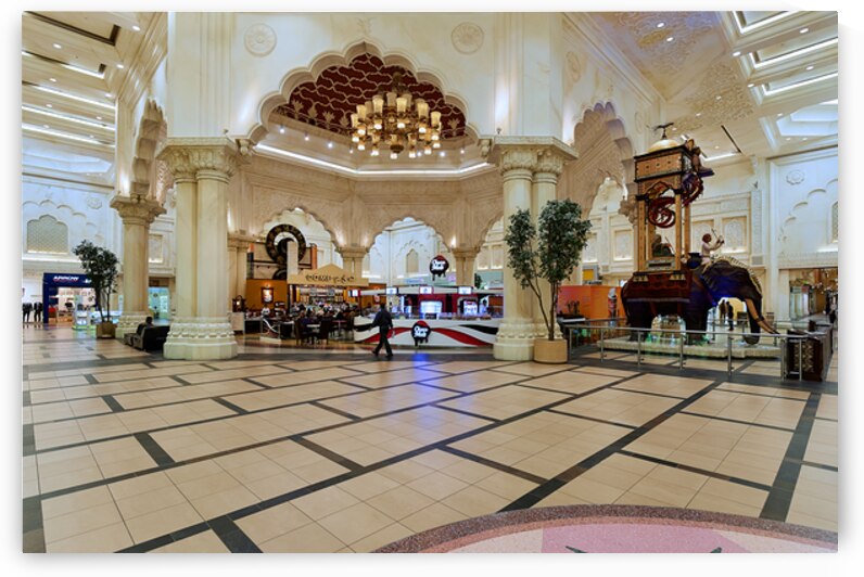 Dubai mall has cafes shops and an elephant statue by Marco Brivio