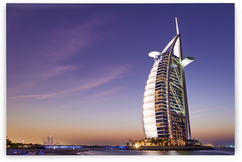 Burj Al Arab hotel standing tall in Dubai at twilight time by Marco Brivio