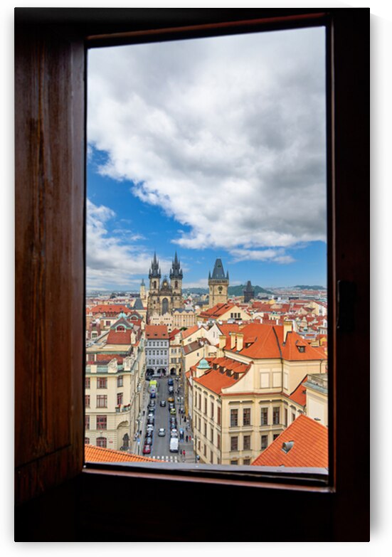 Prague cityscape from window Tyn Church red roofs. by Marco Brivio