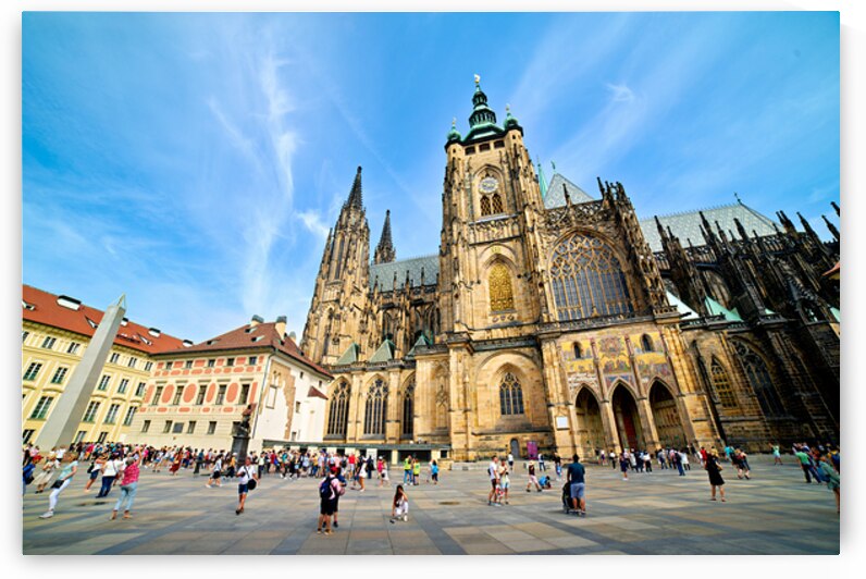 St. Vitus Cathedral in Prague with tourists on a sunny day. by Marco Brivio