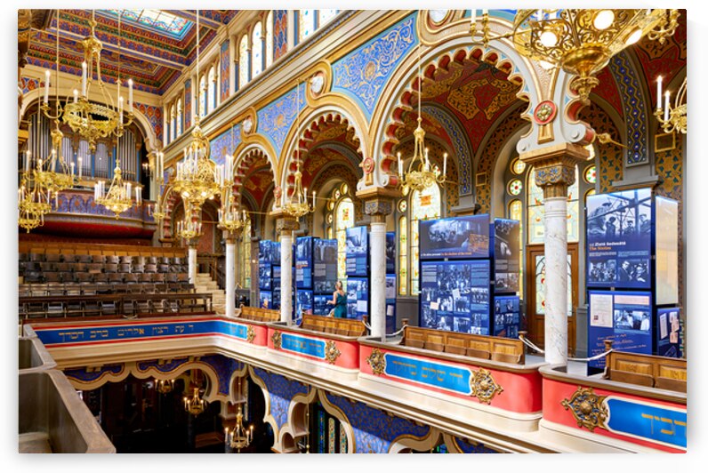 Ornate synagogue interior with historical exhibition displays. by Marco Brivio