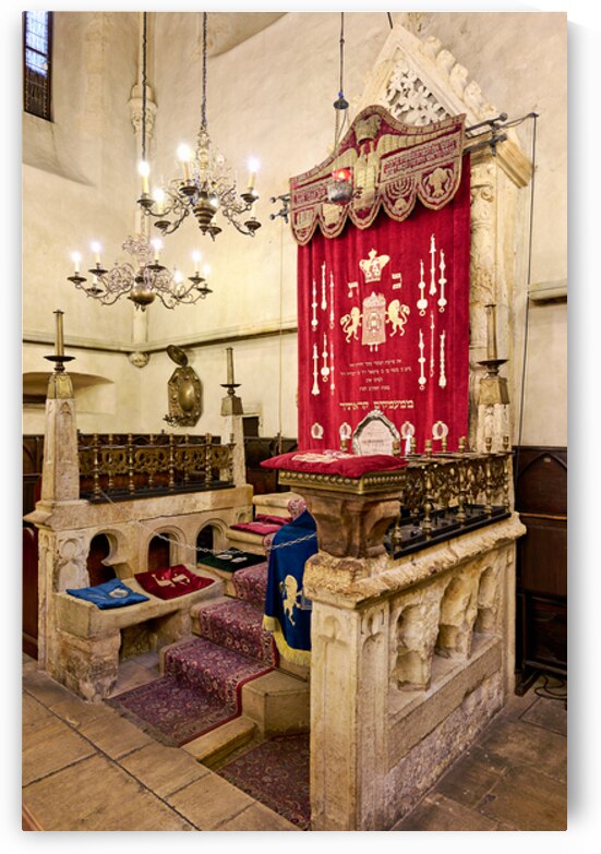 Historic synagogue interior with ornate Ark and bimah. by Marco Brivio