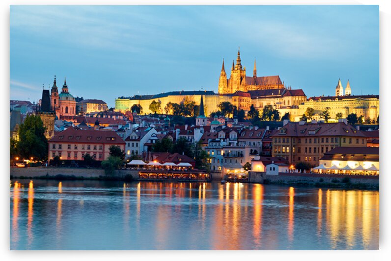 Prague cityscape at night with castle and river reflections. by Marco Brivio