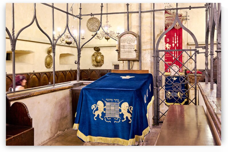 Ancient synagogue interior with ornate blue velvet Torah cover. by Marco Brivio