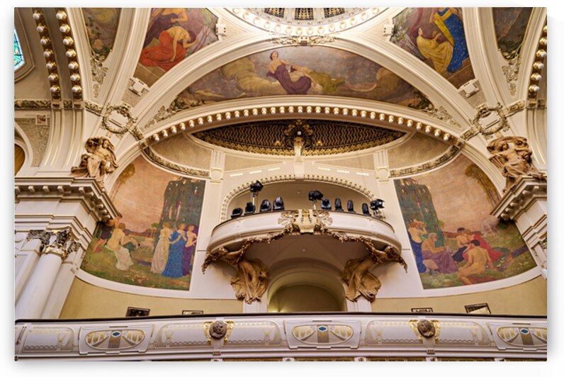 Ornate theater interior with murals sculptures and balcony. by Marco Brivio