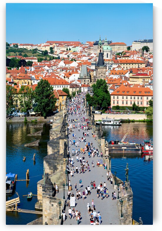 Iconic Charles Bridge Prague teeming with tourists. by Marco Brivio