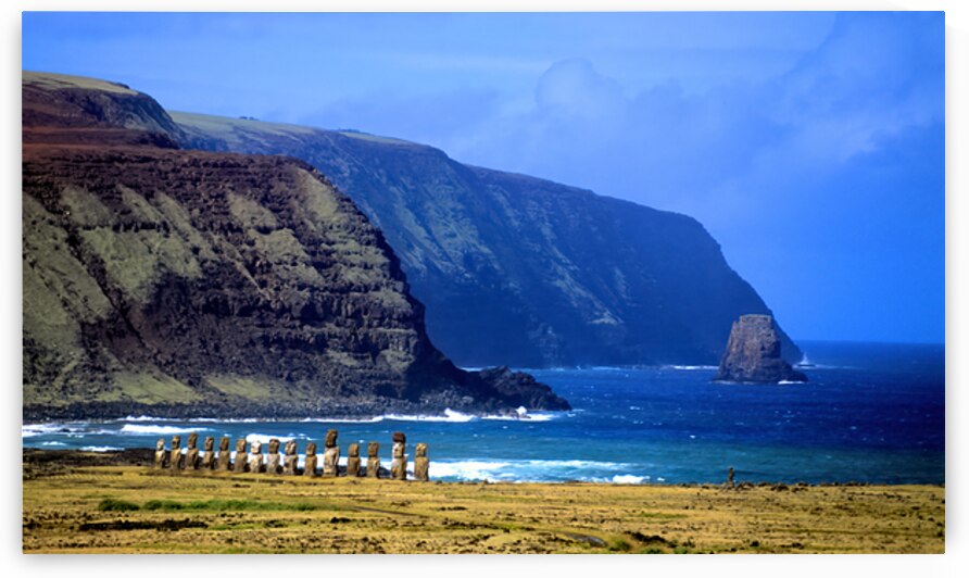 Moai statues on Easter Islands dramatic coastal landscape. by Marco Brivio