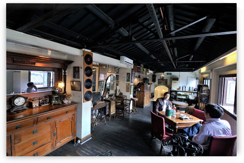 Customers enjoy drinks and food in a vintage cafe in Shanghai by Marco Brivio