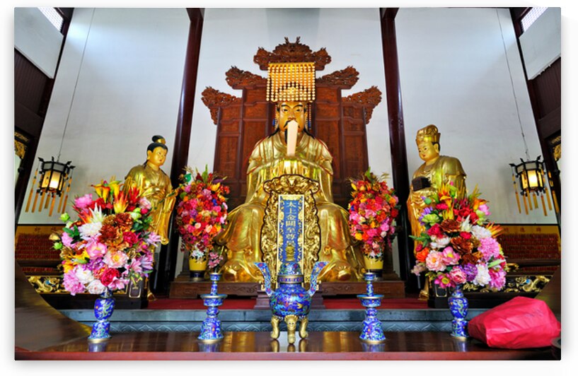 Golden deity statues in Shanghai temple with floral offerings by Marco Brivio