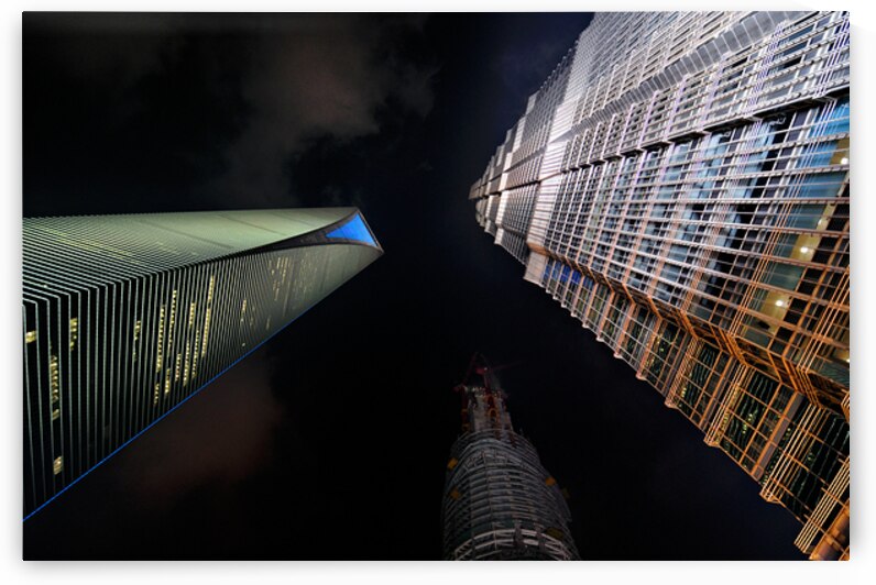 Illuminated skyscrapers of Shanghai light up the night sky by Marco Brivio