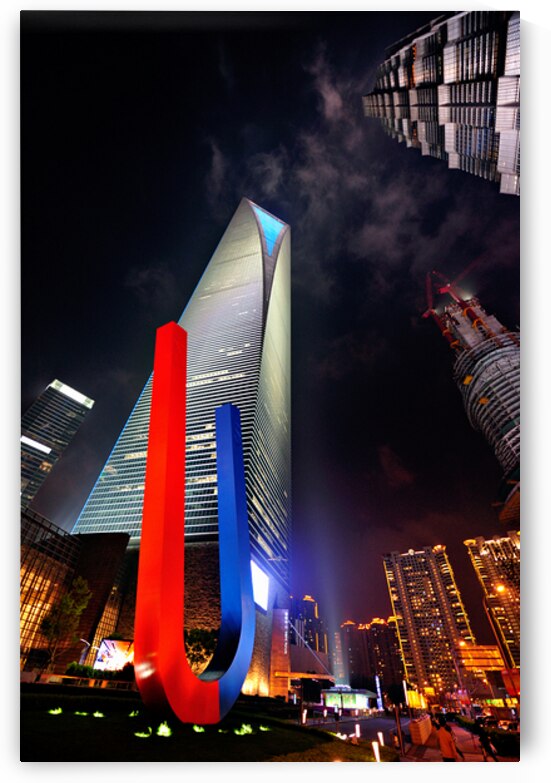 Luminous Shanghai skyscrapers and abstract sculpture at night by Marco Brivio