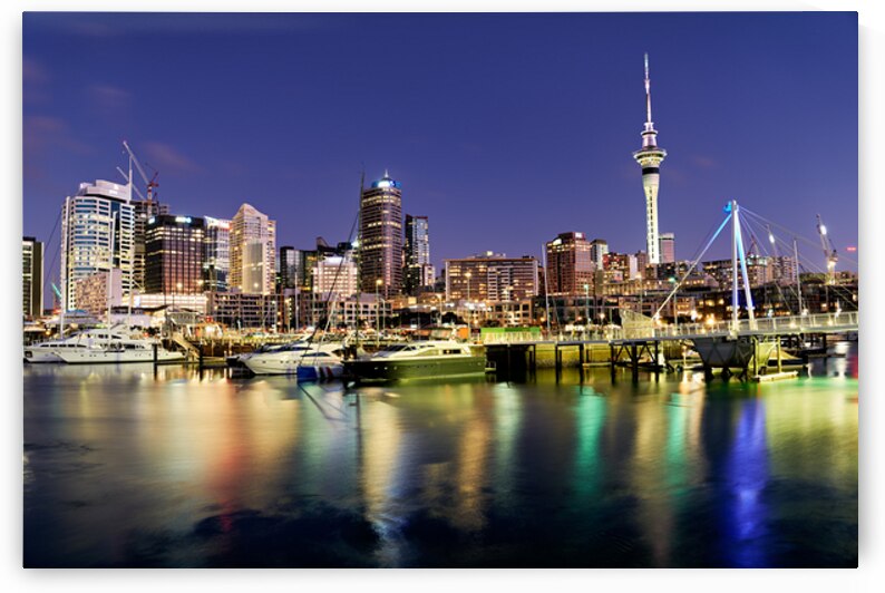 View of Auckland skyline from Viaduct Harbour at sunset by Marco Brivio