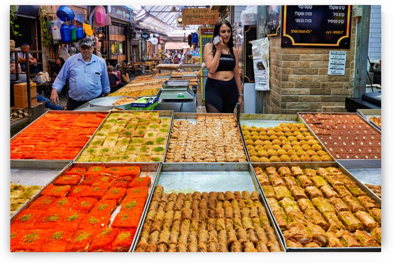 Visitors explore food stands at Mahane Yehuda Market in Jerusale by Marco Brivio