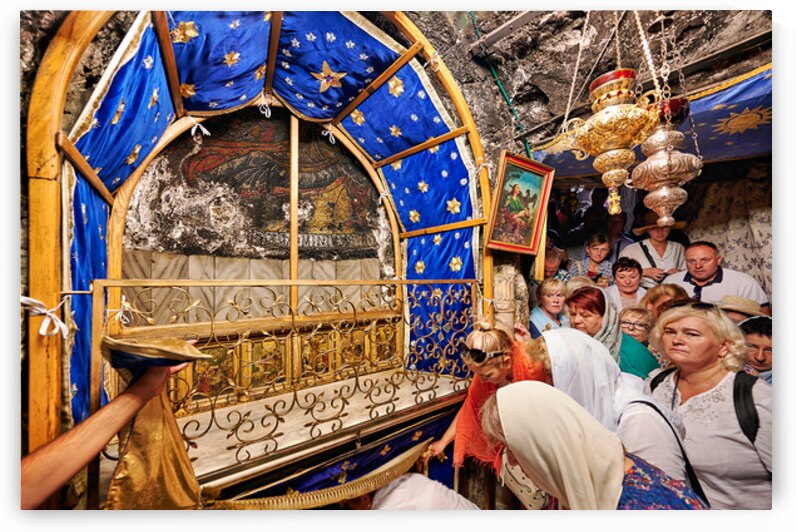 Visiting grotto of nativity in Bethlehem Jerusalem during the d by Marco Brivio