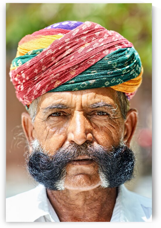 Senior man in colorful turban in Deshnok Rajasthan India by Marco Brivio