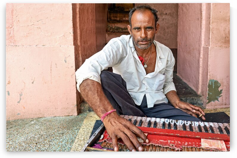 Musician performing in the streets of Deshnok Rajasthan India by Marco Brivio