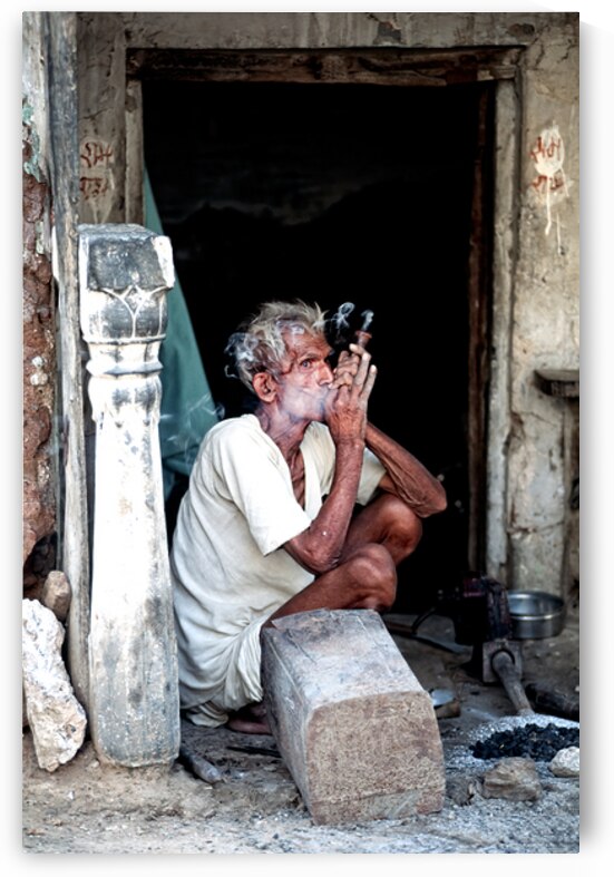 Man smoking hashish in Jaipur Rajasthan during the day by Marco Brivio