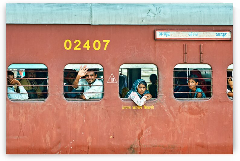 People travel on a train in Rajasthan India during the day by Marco Brivio