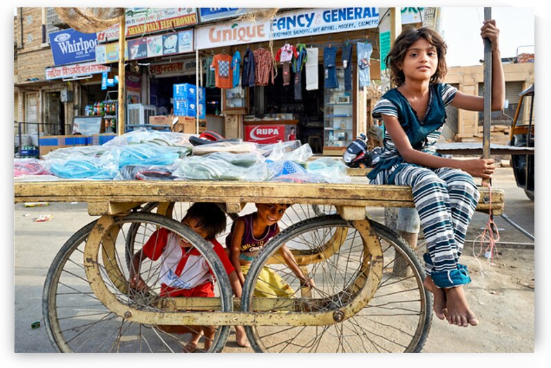 Children playing on a cart in Jaisalmer Rajasthan India by Marco Brivio