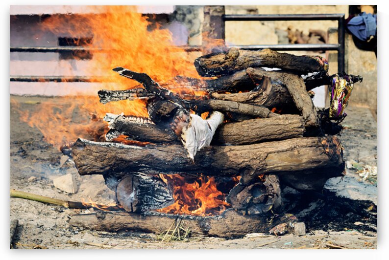 Cremation rite by the Ganges River in Varanasi by Marco Brivio
