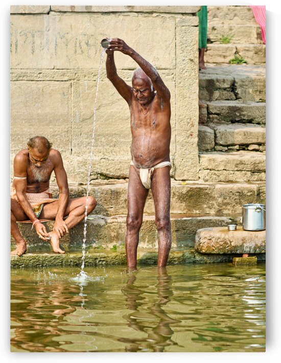 Sacred ablutions at the Ganges river in Varanasi Uttar Pradesh by Marco Brivio