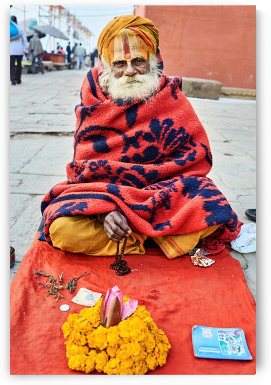 Holy man sadhu sits with offerings in Varanasi Uttar Pradesh by Marco Brivio