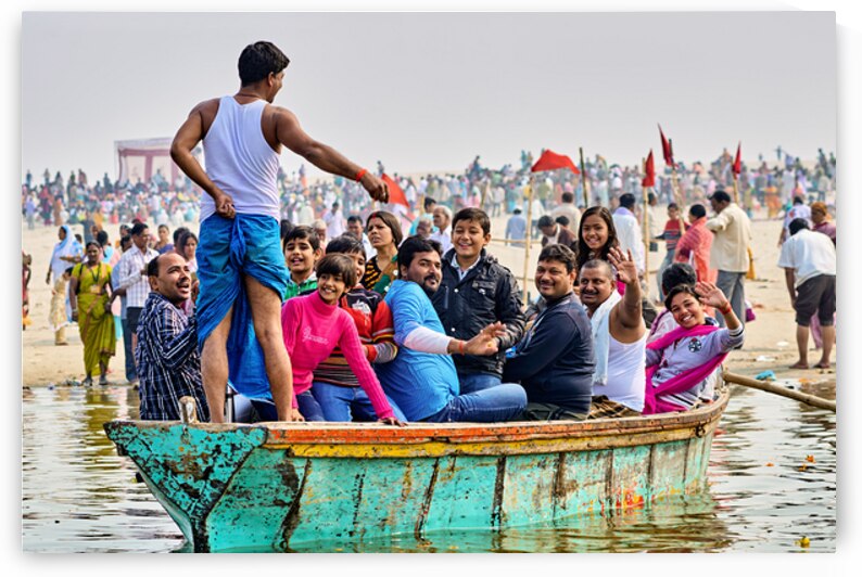 People sit on a boat on the Ganges River by Marco Brivio