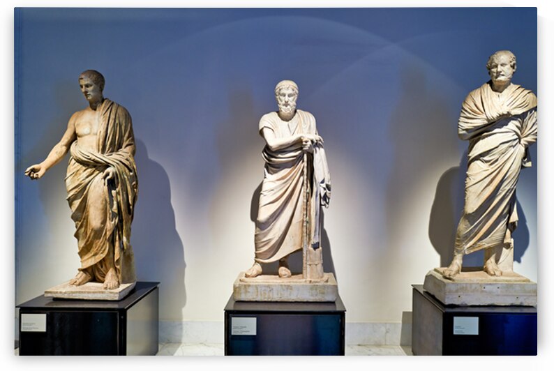 Statues of ancient philosophers displayed in museum setting by Marco Brivio