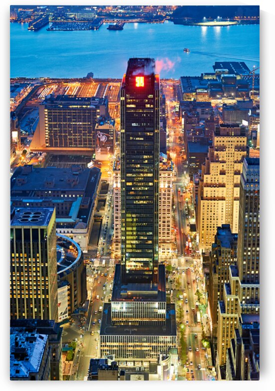 Aerial view of Manhattan at dusk showing city lights and buildin by Marco Brivio