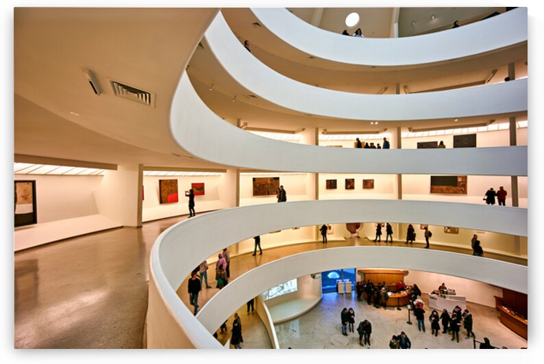People walk and look at art inside the Guggenheim Museum in New  by Marco Brivio