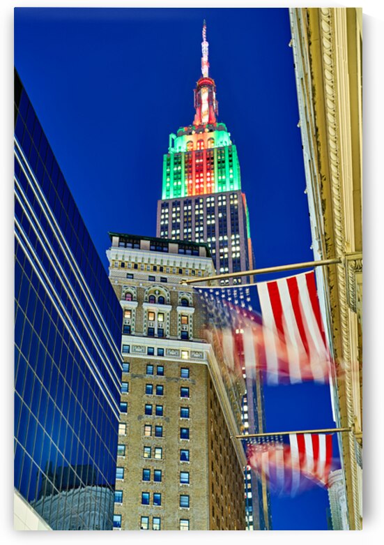 Empire State Building shines above Manhattan at dusk in New York by Marco Brivio