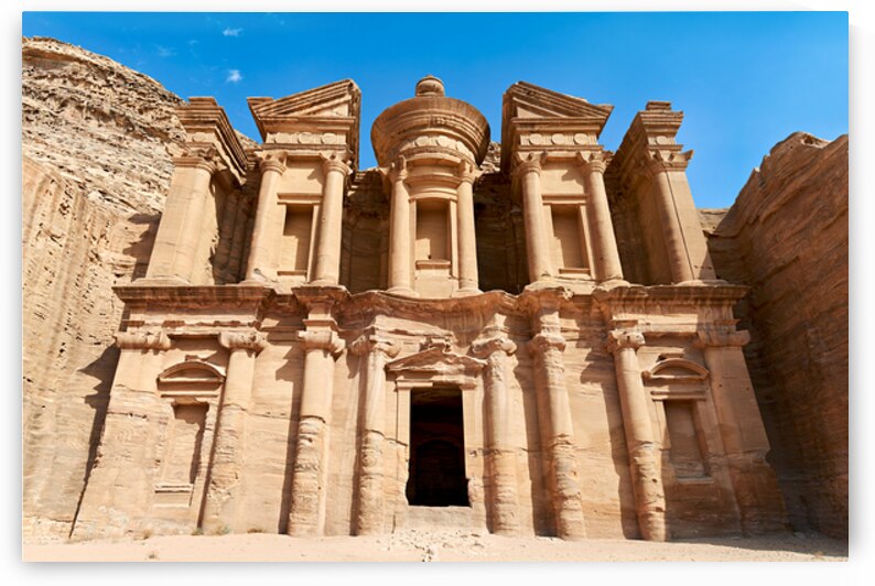Visit to the Monastery at Petra in Jordan under clear blue sky by Marco Brivio