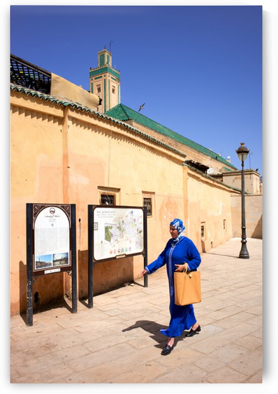 Woman walks in the Medina of Fez Morocco during daytime by Marco Brivio