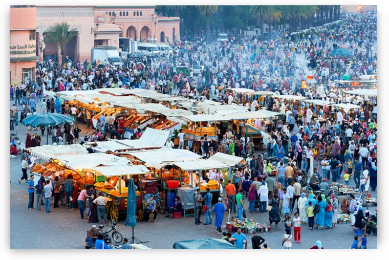 Sunset at Djema el Fna square in Marrakesh with lively crowds by Marco Brivio