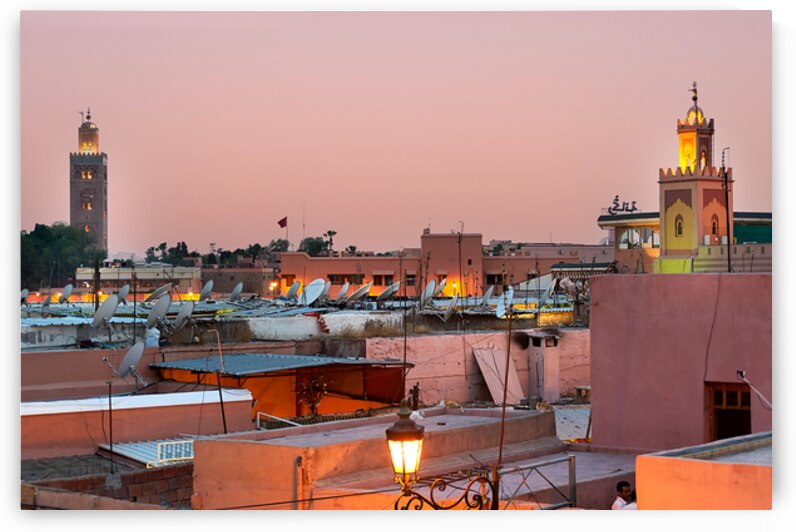 Cityscape of Marrakesh at sunset with buildings and minarets vis by Marco Brivio