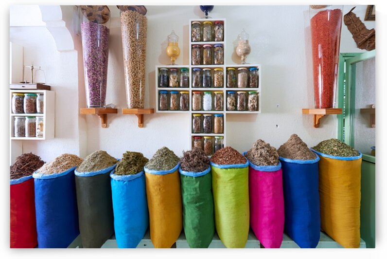 Herbal remedy shop in Marrakesh showing colorful bags of herbs by Marco Brivio