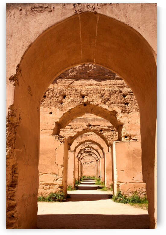 Exploring the Royal Stables in Meknes Morocco with stunning arch by Marco Brivio