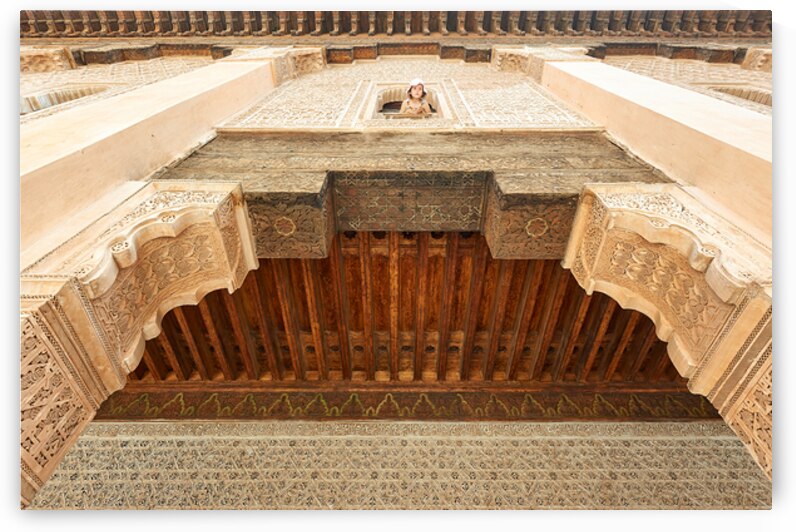 Child looks out from window of Madrasa Ben Youssef in Marrakesh by Marco Brivio